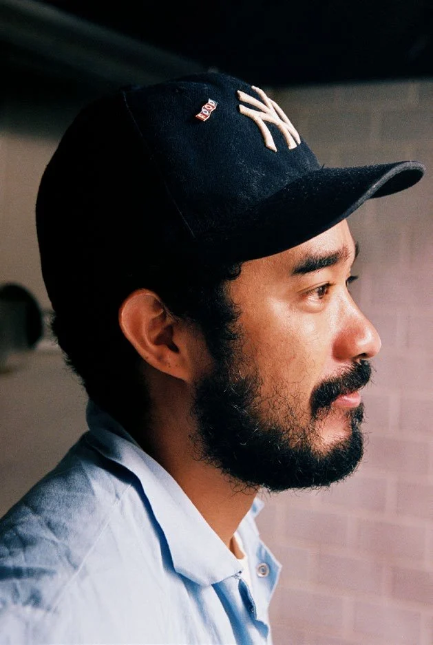 Portrait of Lucien Smith wearing a Yankees cap, from the Justsmile FOOD feature