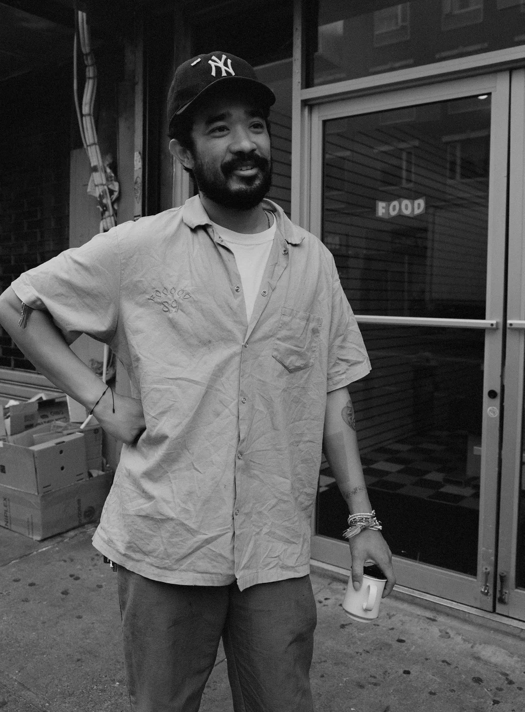 Lucien Smith outside FOOD in a black-and-white photograph