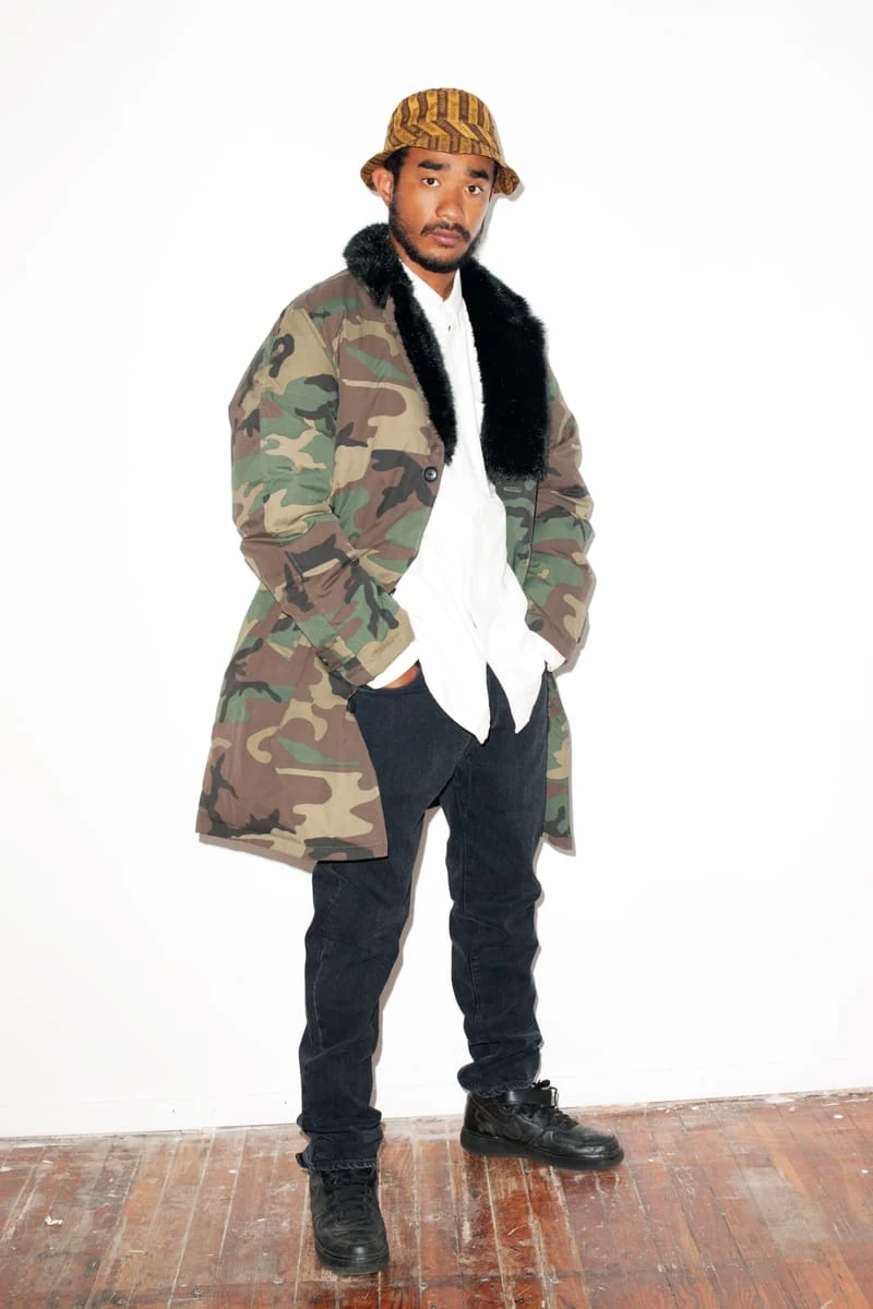 Lucien Smith in a camouflage coat and patterned cap for the SENSE Supreme Fall/Winter 2014 editorial