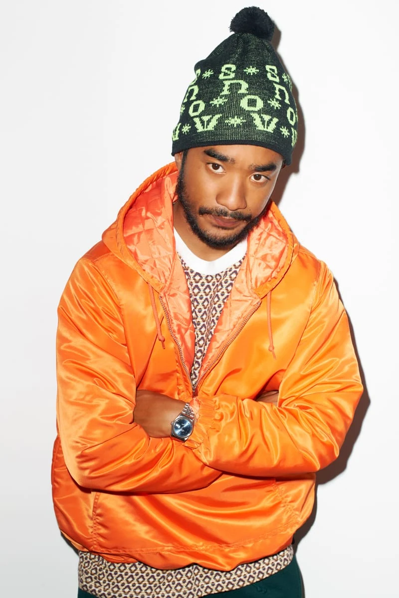 Lucien Smith in an orange jacket and black-and-green knit cap for the SENSE Supreme Fall/Winter 2014 editorial
