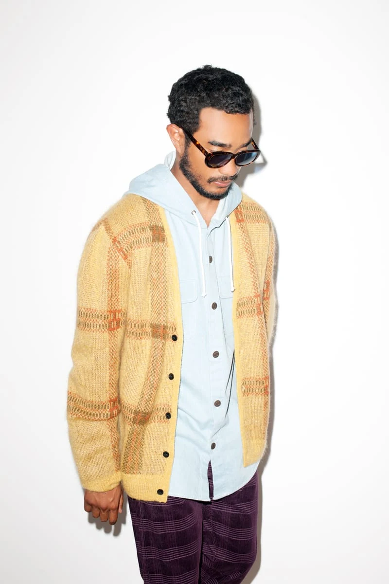 Lucien Smith in a tan plaid cardigan and sunglasses for the SENSE Supreme Fall/Winter 2014 editorial