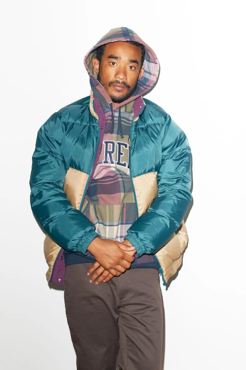 Lucien Smith in a teal and beige jacket over a plaid hood for the SENSE Supreme Fall/Winter 2014 editorial