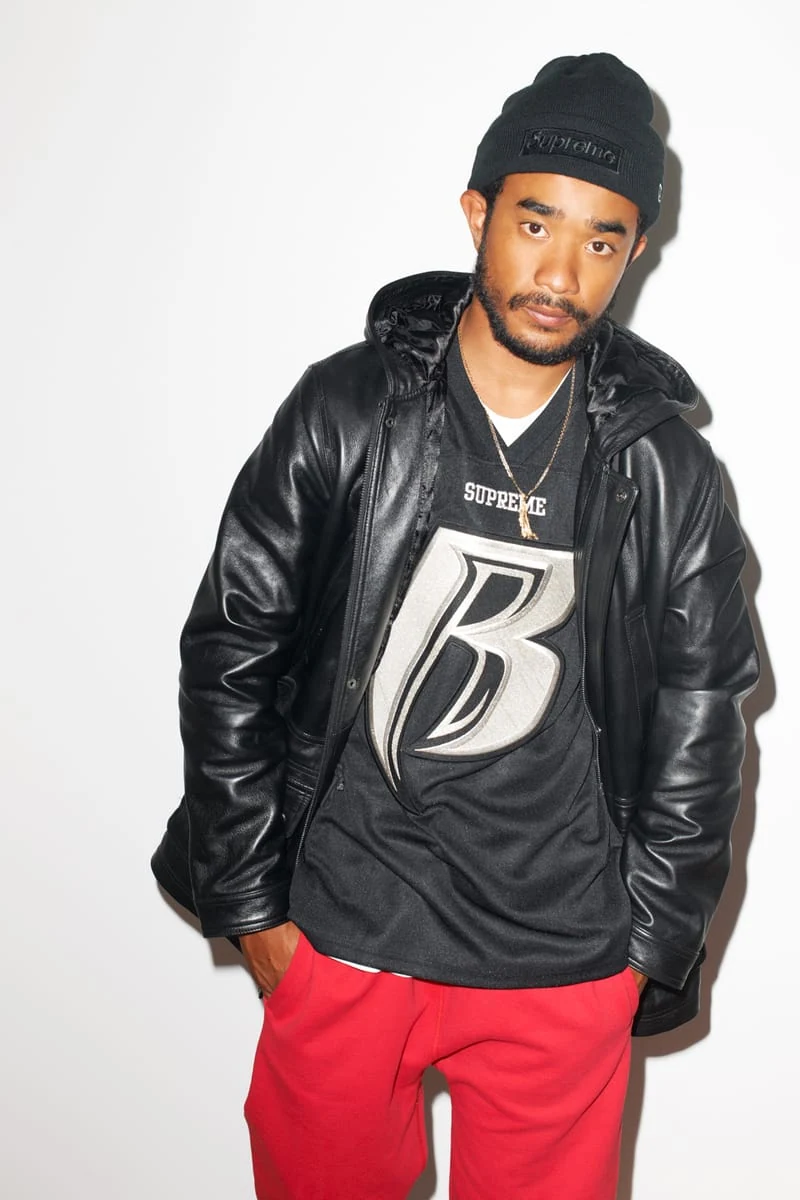 Lucien Smith in a black leather jacket, jersey and red trousers for the SENSE Supreme Fall/Winter 2014 editorial